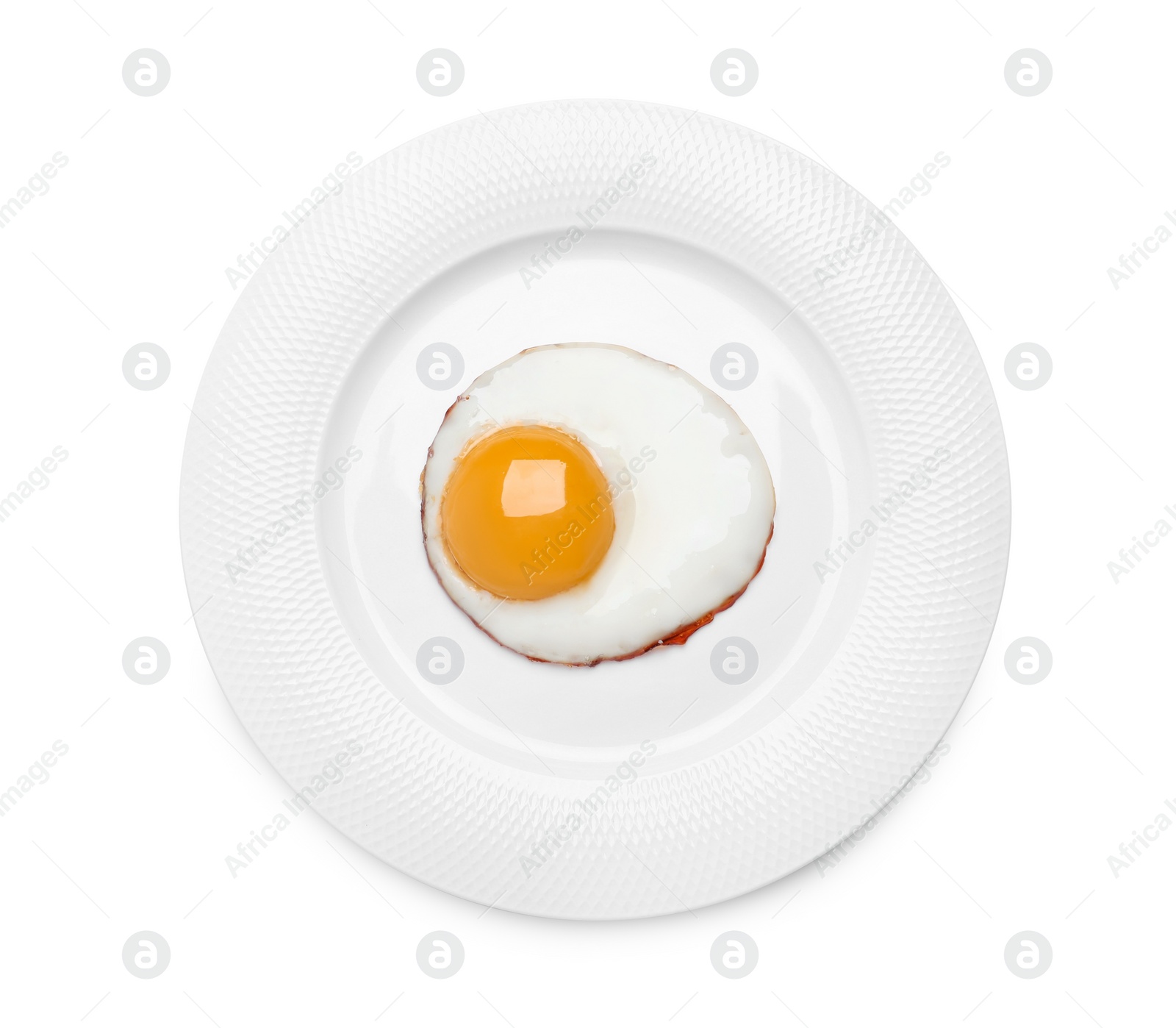 Photo of Plate with delicious fried egg isolated on white, top view