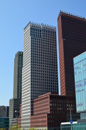 Photo of Exterior of beautiful modern buildings against blue sky