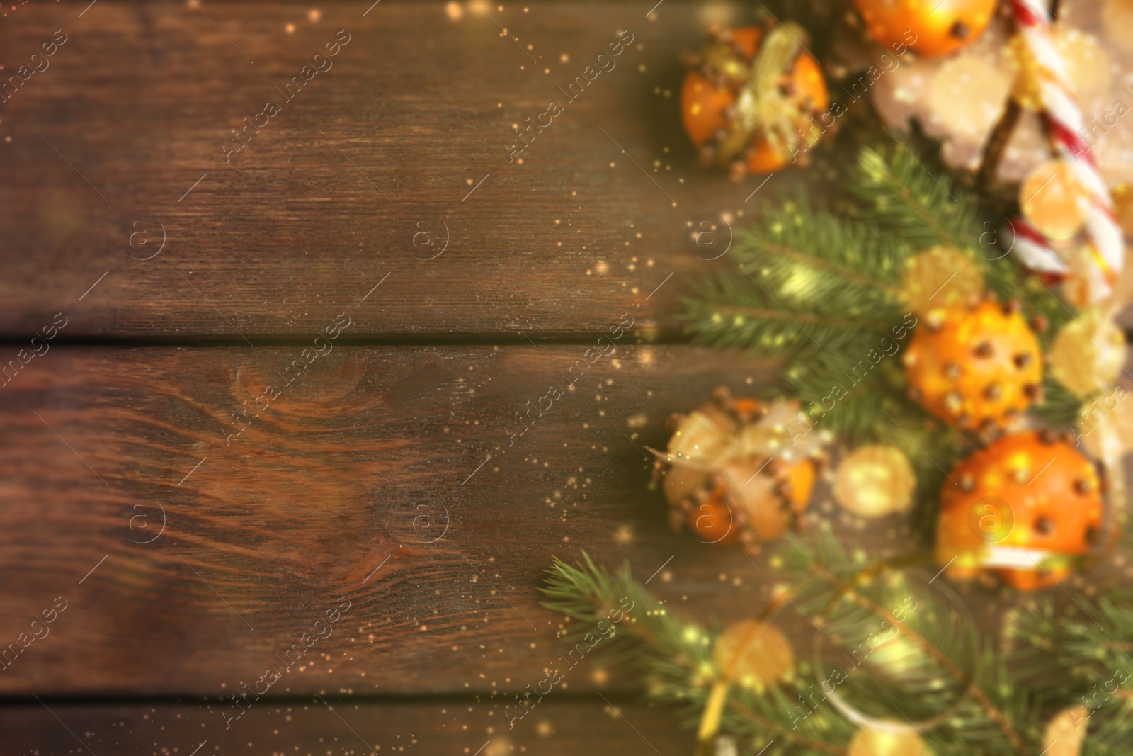 Image of Flat lay composition with pomander balls of fresh tangerines and cloves on wooden background, space for text. Christmas decoration