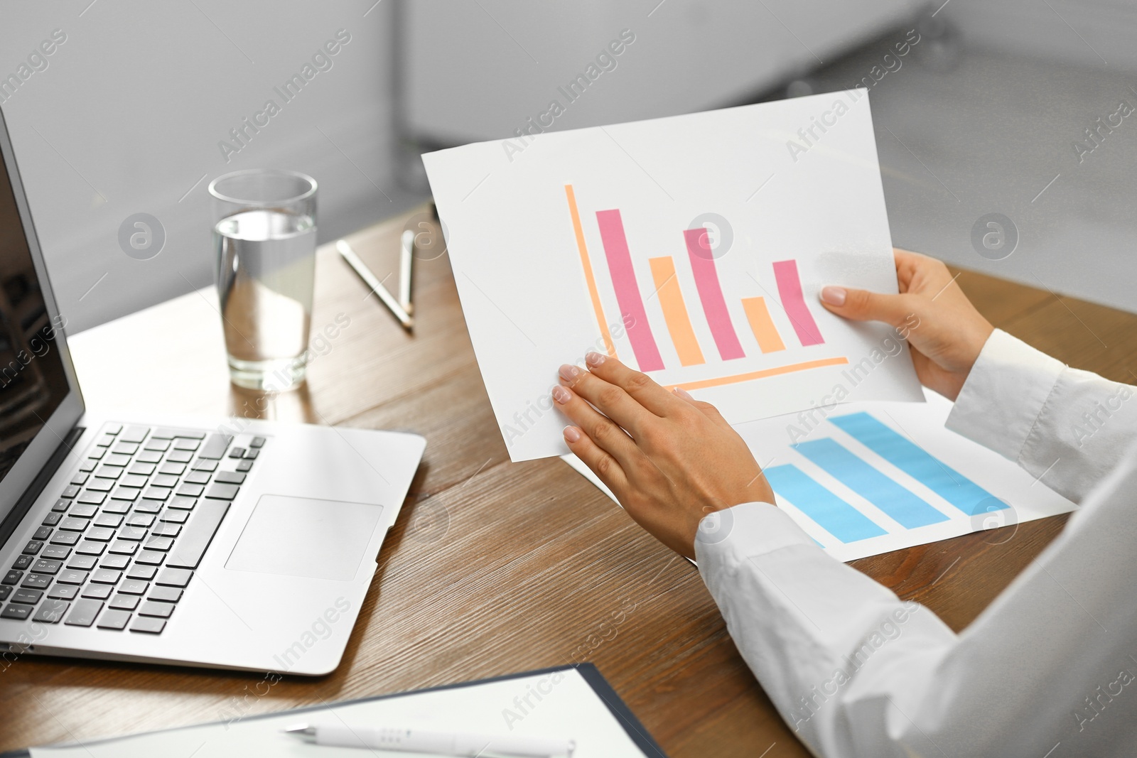 Photo of Business trainer working at table in office, closeup