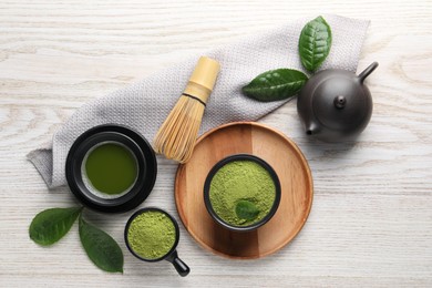 Photo of Flat lay composition with green matcha powder on white wooden table