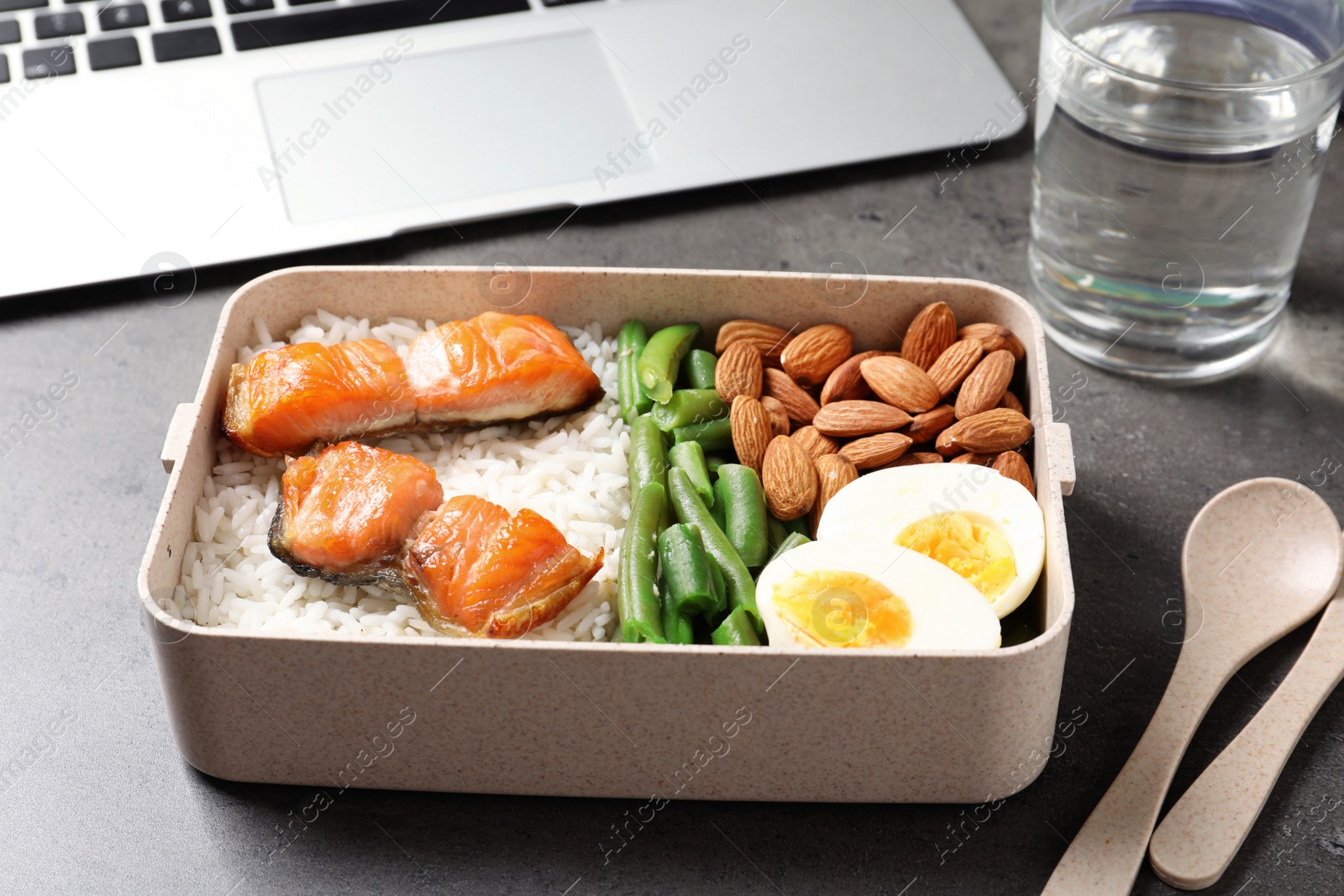 Photo of Container with natural protein food on office table