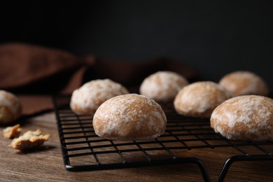 Photo of Tasty homemade gingerbread cookies on wooden table, closeup