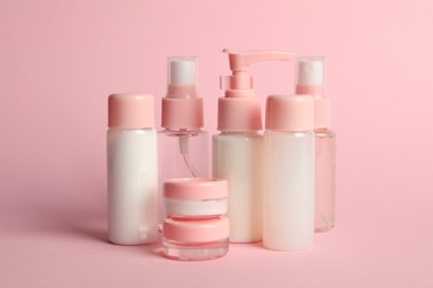 Cosmetic travel on pink background. Bath accessories