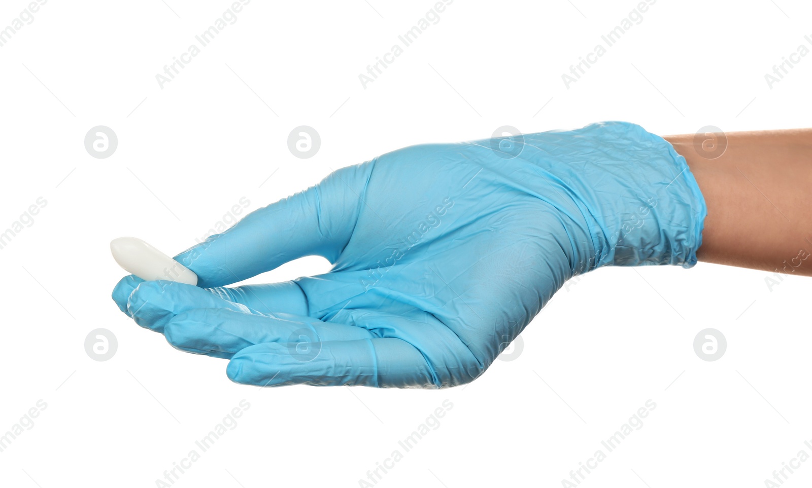 Photo of Doctor holding suppository on white background. Hemorrhoid problems