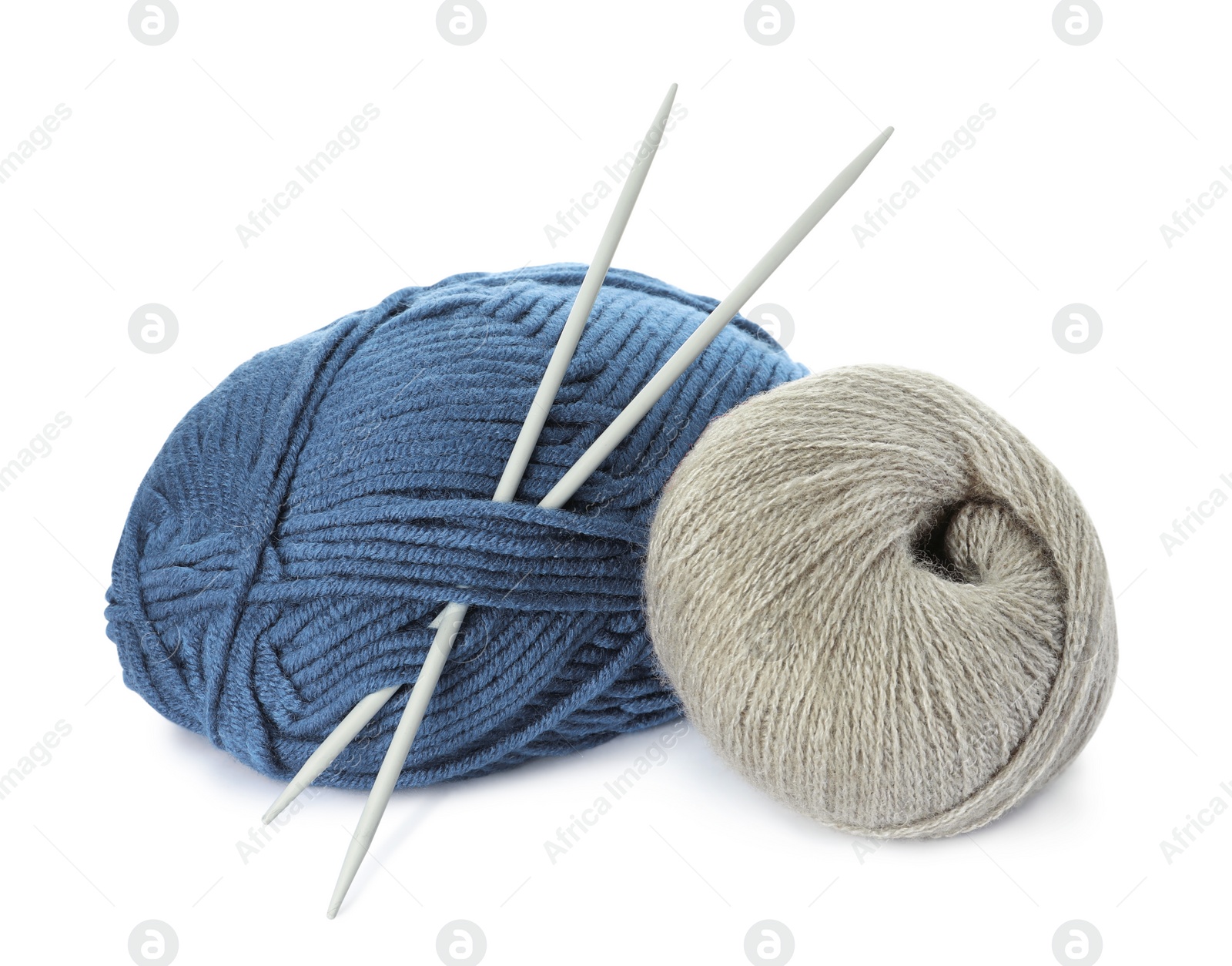 Photo of Different balls of woolen knitting yarns and needles on white background