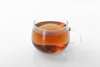 Tasty tea in cup on white background