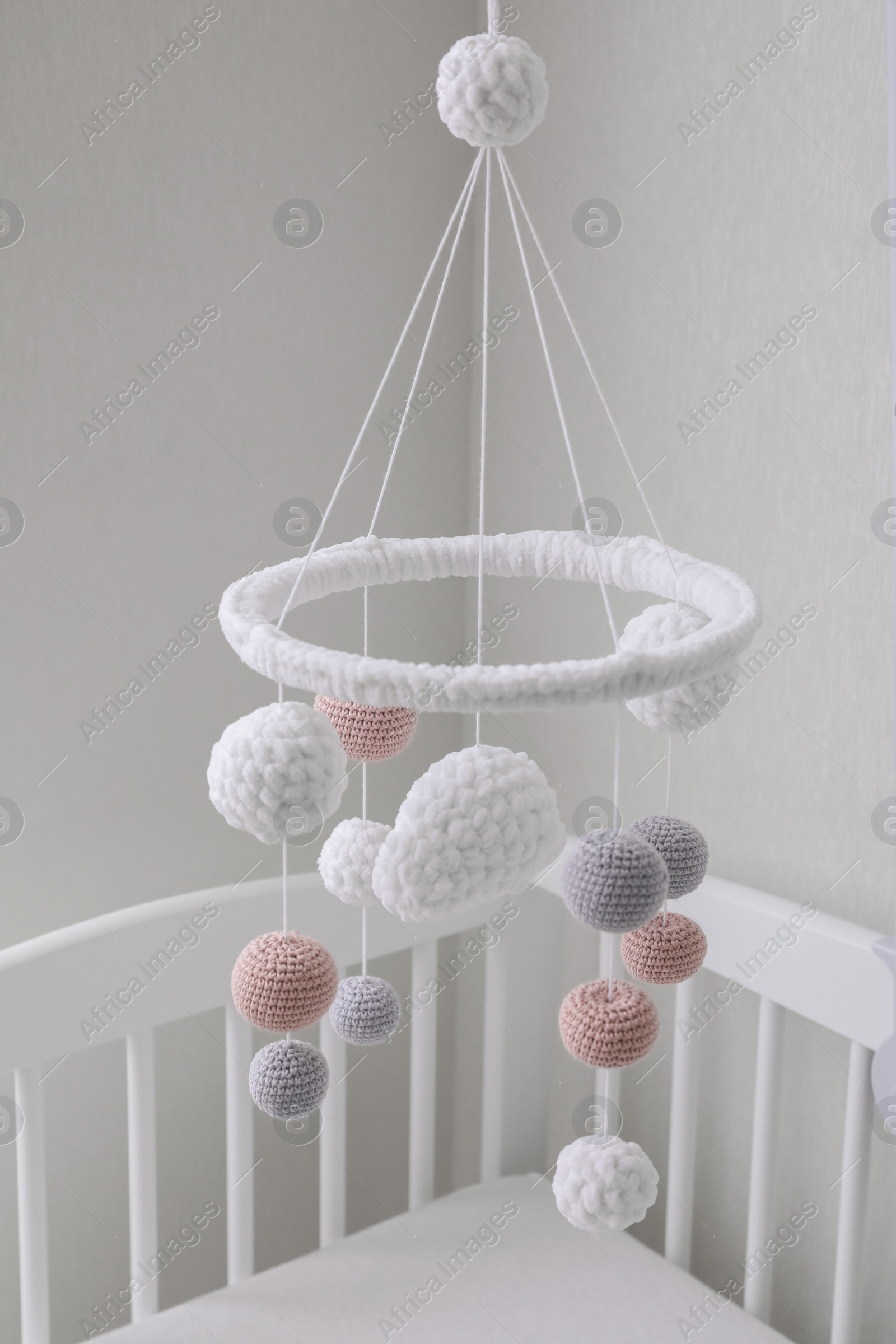 Modern baby mobile under crib in children's room Photo of Modern baby mobile under crib in children's room