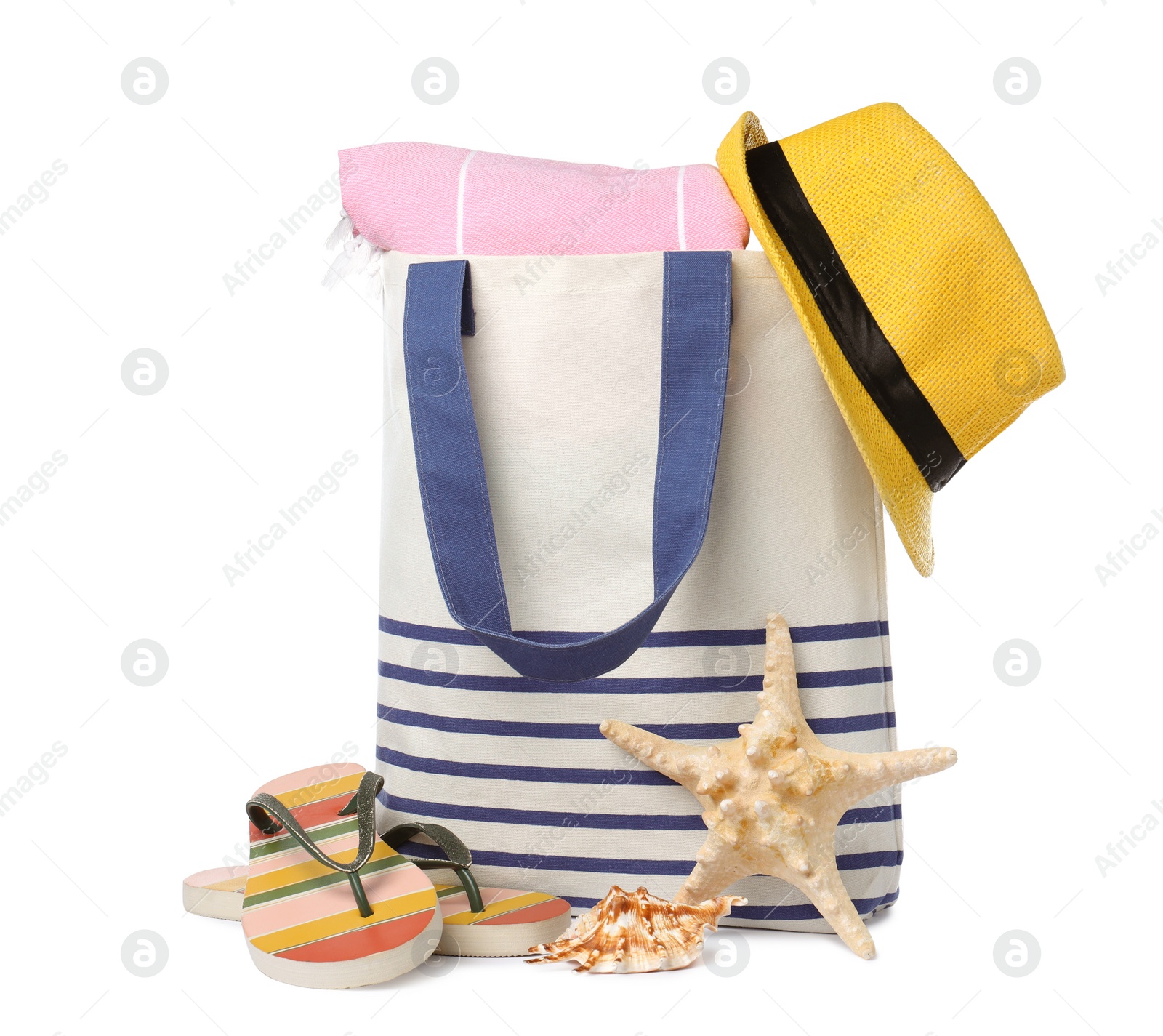 Photo of Stylish bag with beach accessories isolated on white