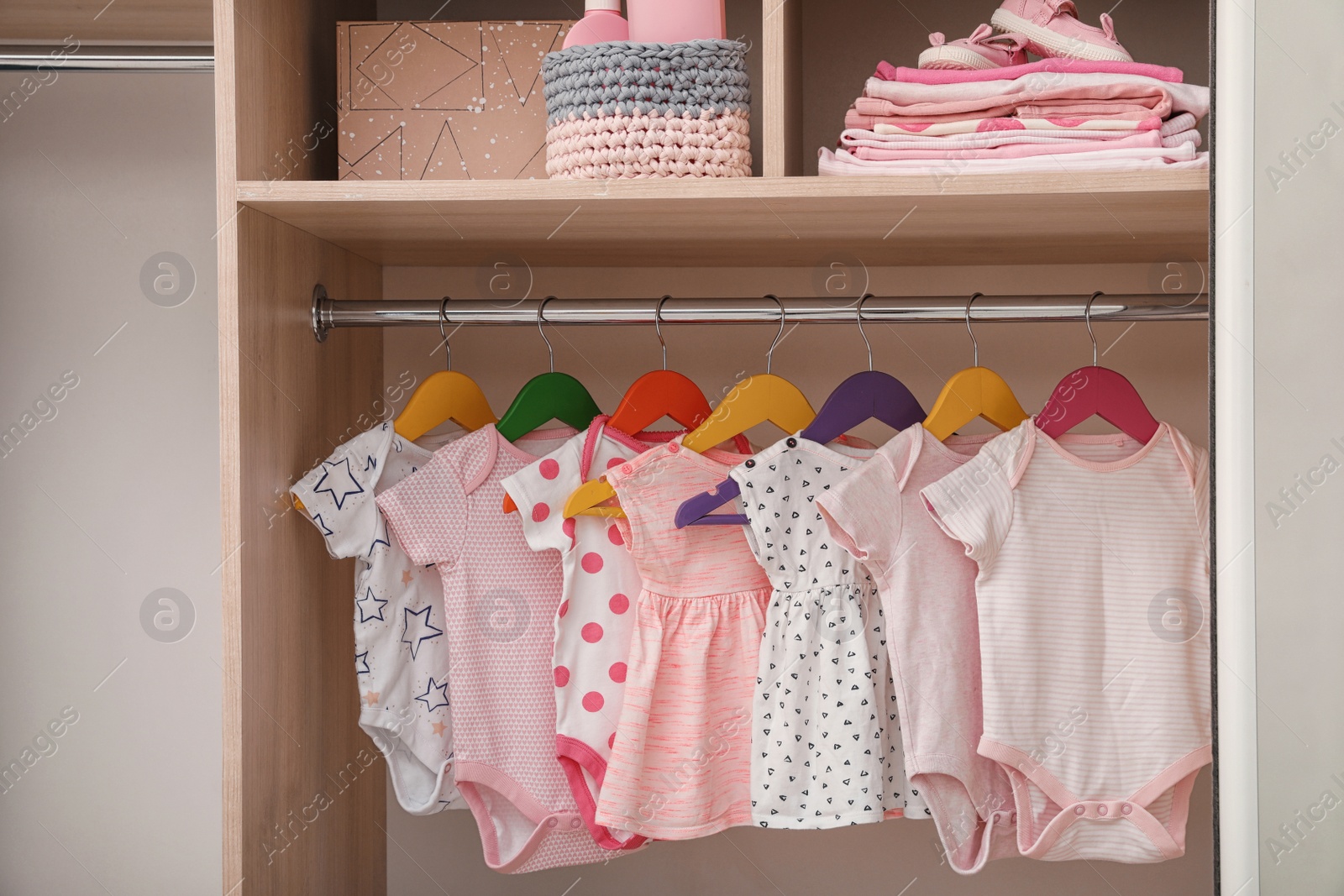 Photo of Wardrobe with cute baby clothes and home stuff