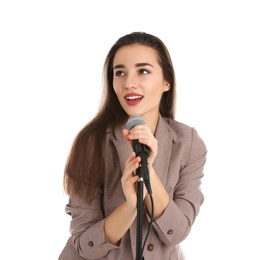 Photo of Young stylish woman in jacket posing with microphone on white background