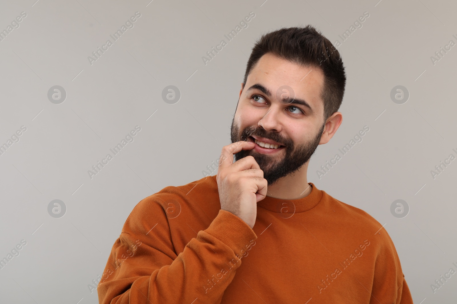 Photo of Man with clean teeth smiling on gray background, space for text