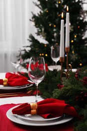 Beautiful table setting with Christmas decor indoors