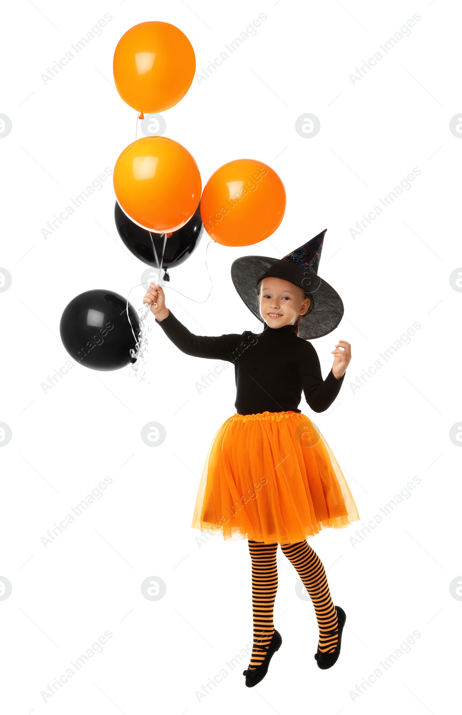 Photo of Cute little girl with balloons wearing Halloween costume on white background