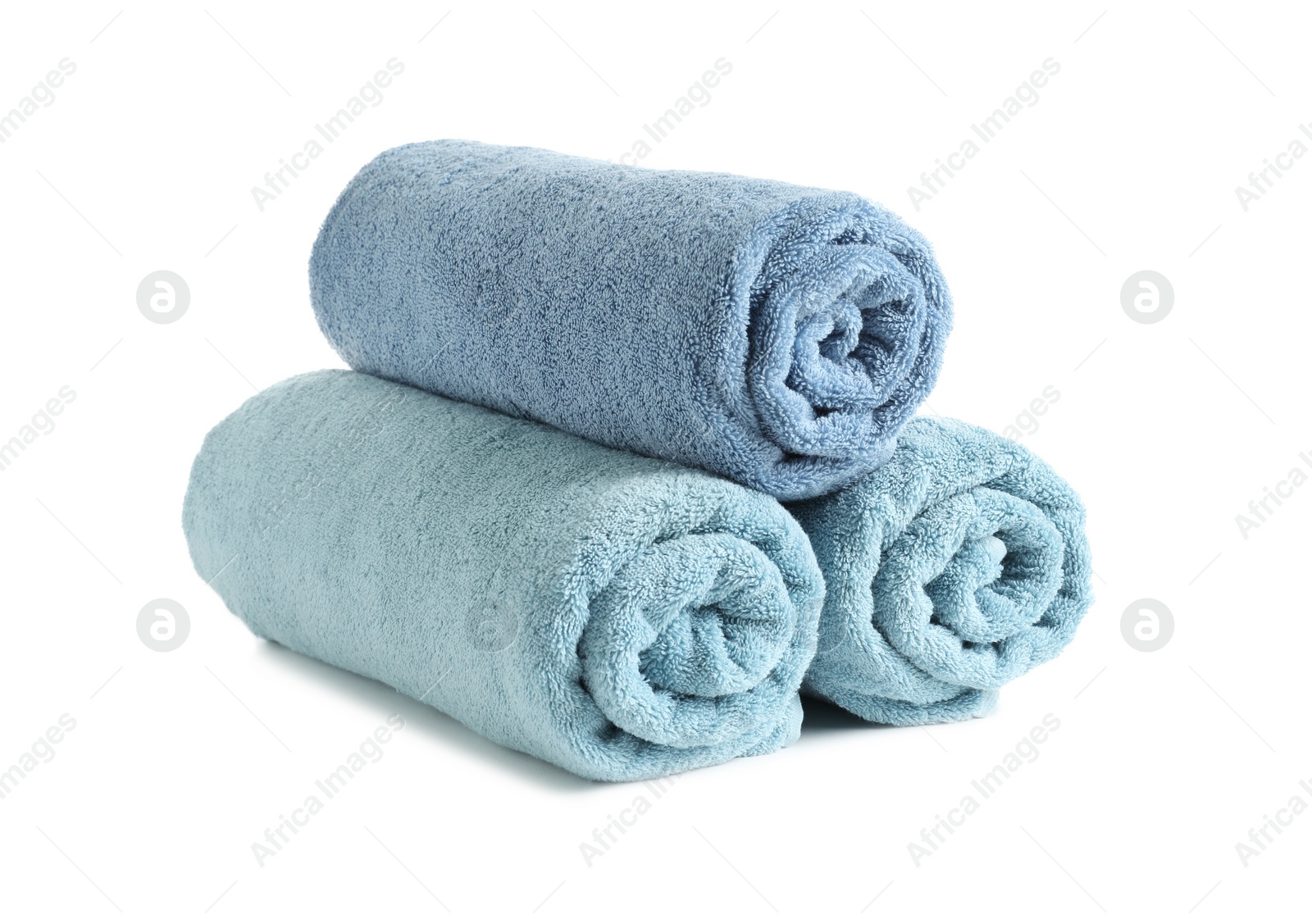 Photo of Rolled soft terry towels on white background