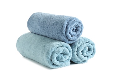 Rolled soft terry towels on white background