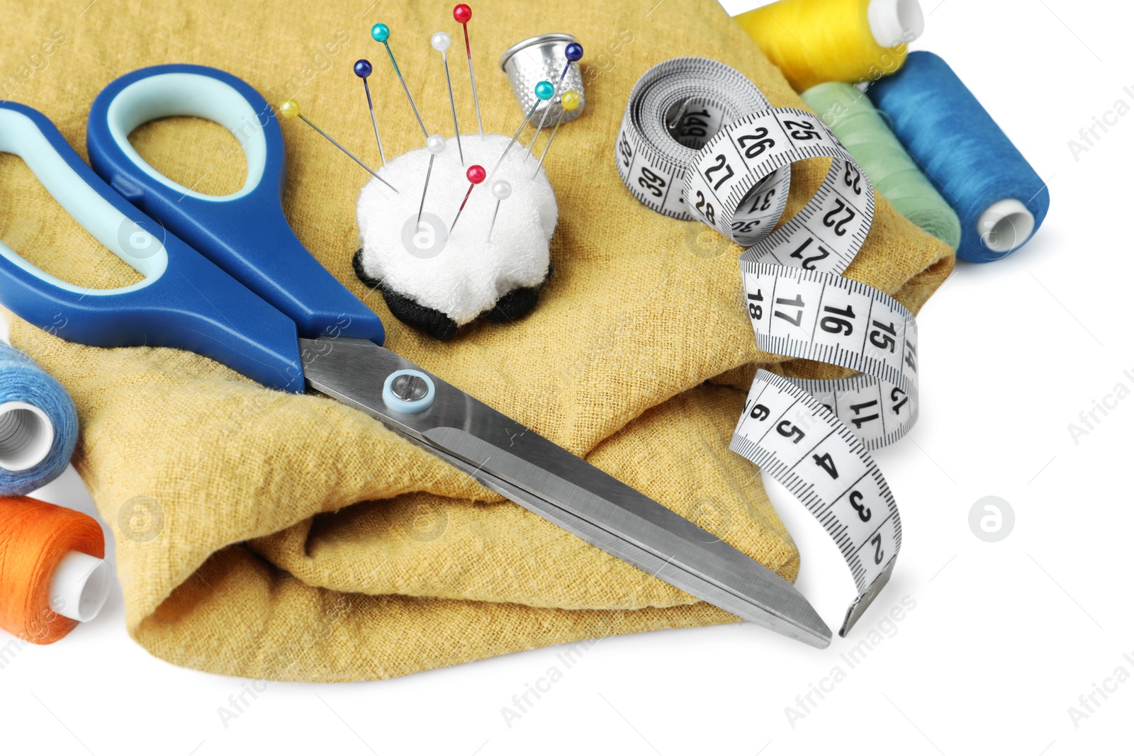 Photo of Set of different sewing accessories on white background, closeup