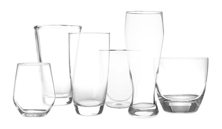 Image of Set of empty glasses on white background