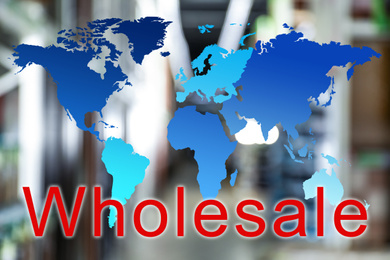 Wholesale business. World map and blurred view of warehouse on background