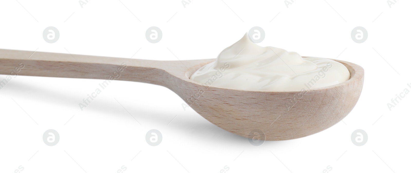 Photo of One wooden spoon with mayonnaise isolated on white