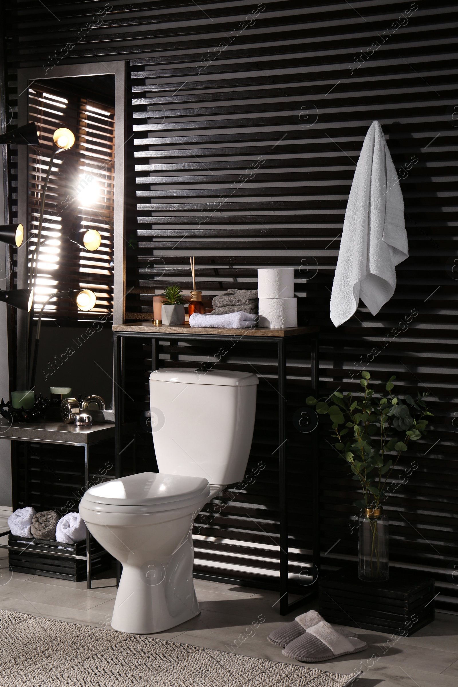 Photo of Stylish bathroom interior with toilet bowl and other essentials