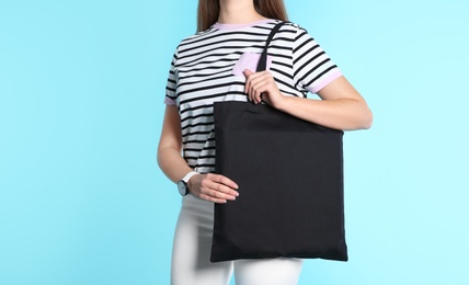 Photo of Woman with eco bag on color background. Mock up for design