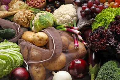 Photo of Different fresh ripe vegetables and fruits as background, closeup