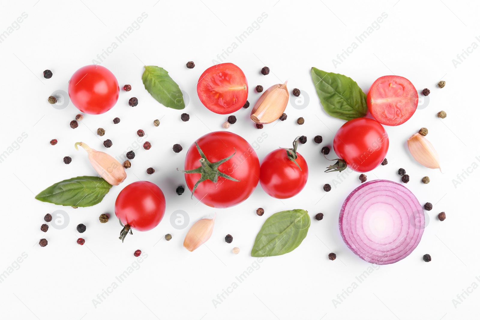 Photo of Flat lay composition with different whole and cut tomatoes on white background