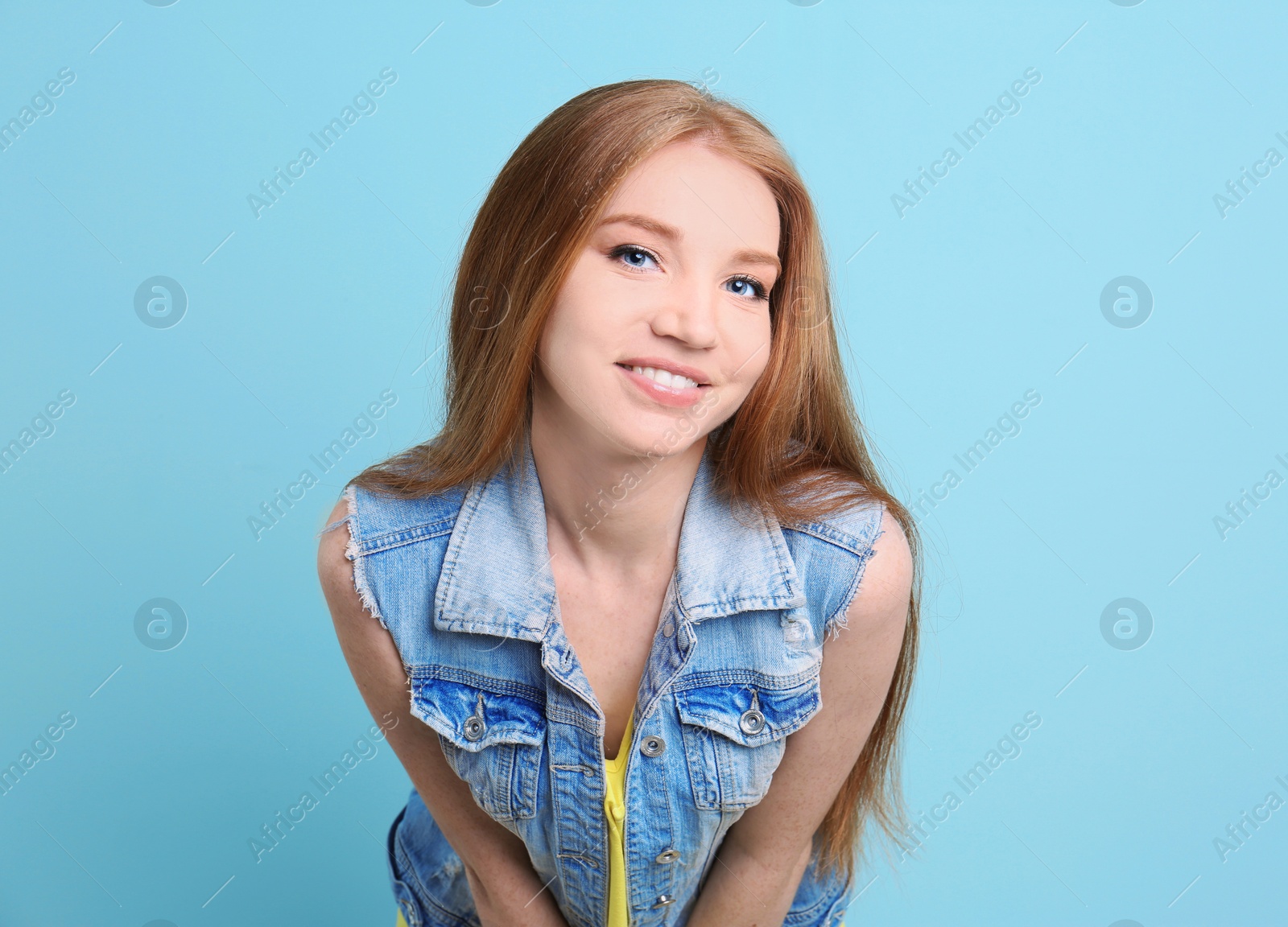 Photo of Portrait of young model with beautiful  hair on color background