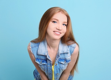 Portrait of young model with beautiful  hair on color background
