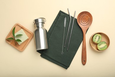 Photo of Flat lay composition with eco friendly products on beige background