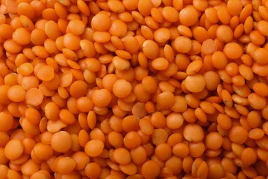 Photo of Heap of raw lentils as background, closeup view