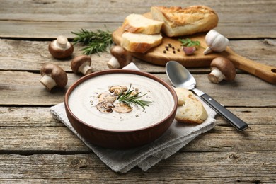 Fresh homemade mushroom soup served on wooden table