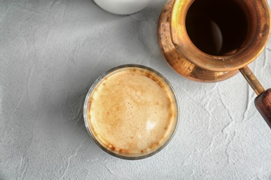 Photo of Glass of aromatic hot coffee on table