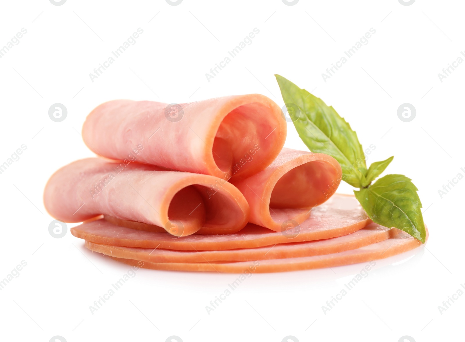 Photo of Slices of tasty fresh ham with basil isolated on white