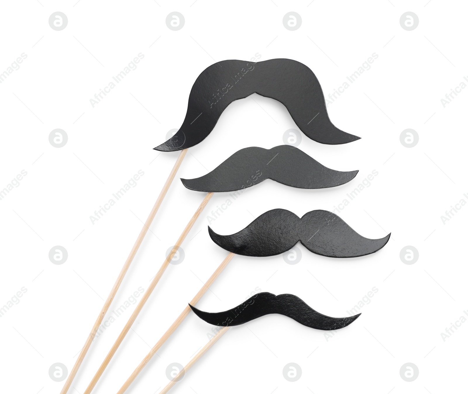 Photo of Fake paper mustaches with party props isolated on white, top view