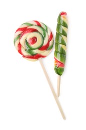 Colorful lollipops on white background, top view