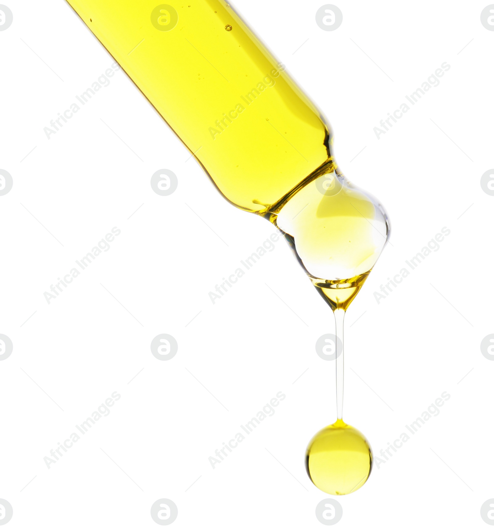 Photo of Dripping tincture from pipette isolated on white