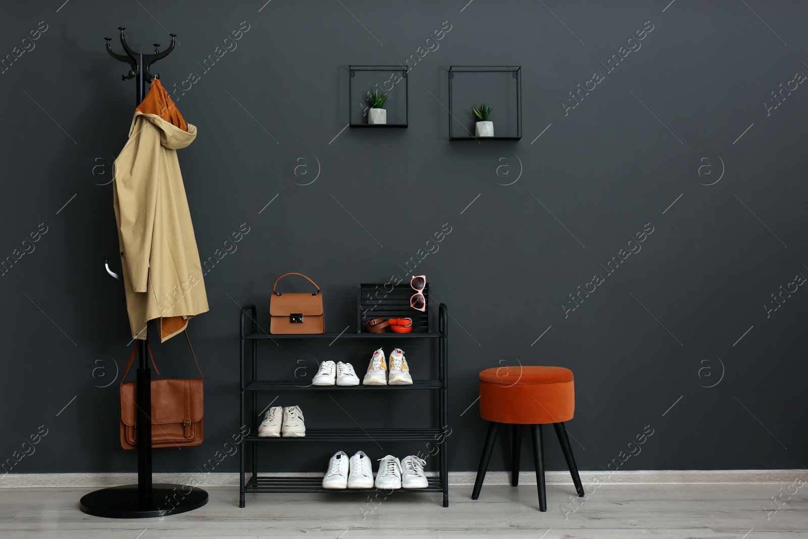 Photo of Hallway interior with stylish furniture, clothes and accessories