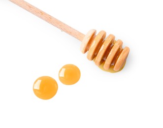 Wooden dipper and fresh honey on white background, top view