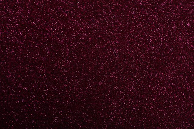Photo of Beautiful shiny burgundy glitter as background, closeup