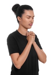 Photo of African American woman with clasped hands praying to God on white background