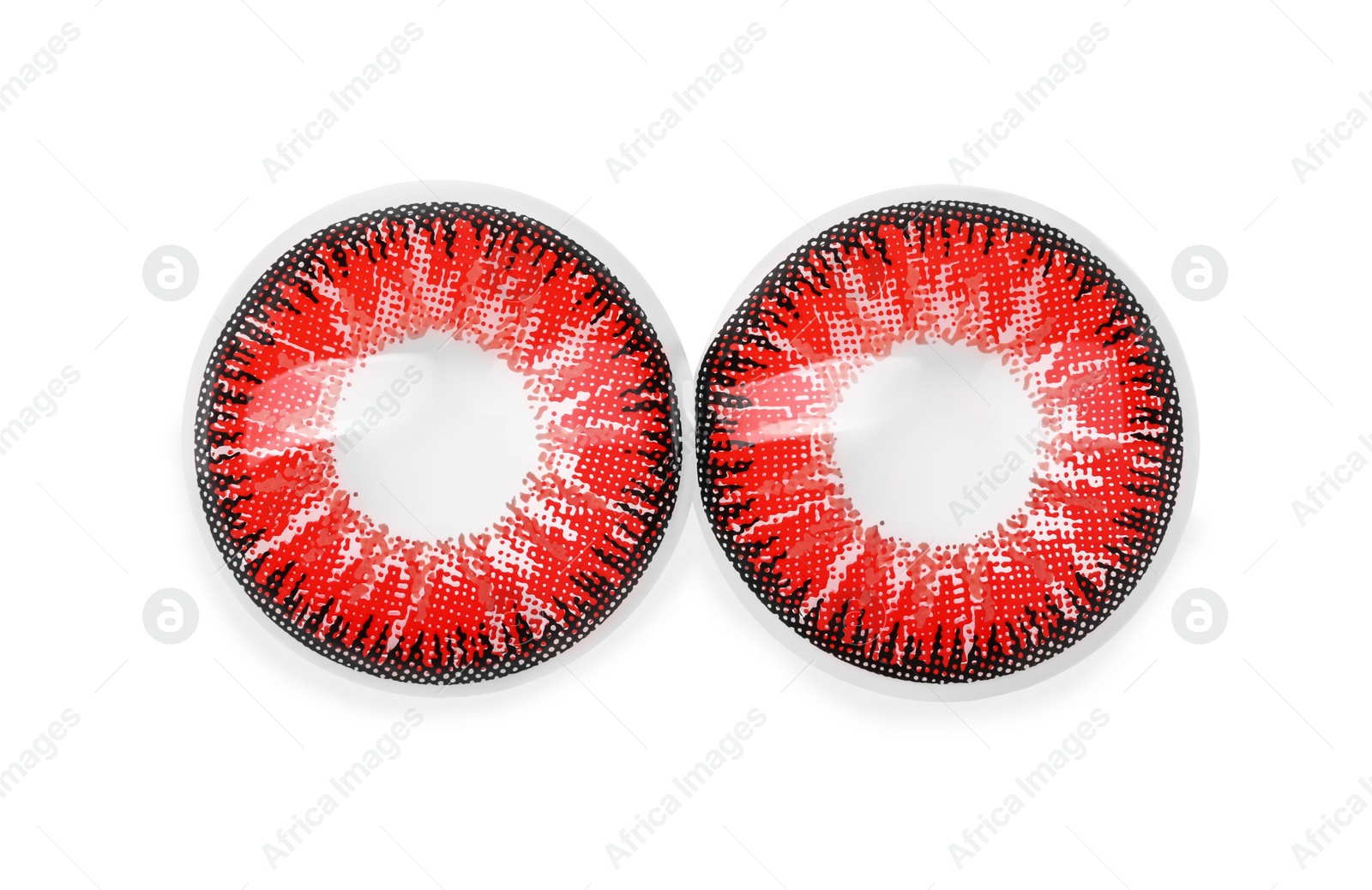 Photo of Two red contact lenses isolated on white, top view