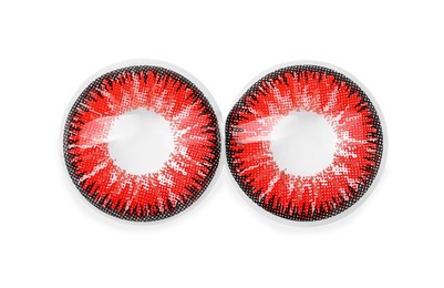 Photo of Two red contact lenses isolated on white, top view
