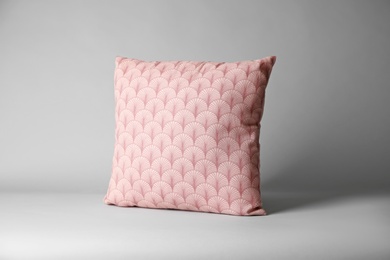 Soft decorative pillow on light background