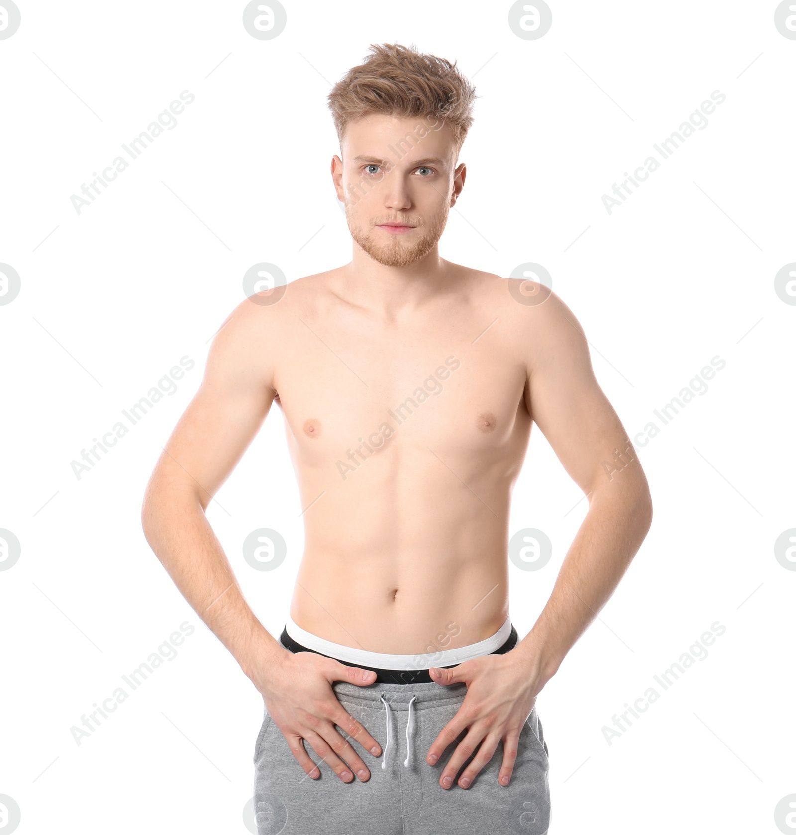 Photo of Portrait of young man with slim body on white background