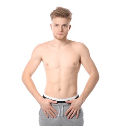 Portrait of young man with slim body on white background