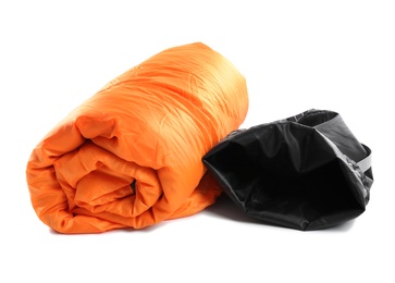 Photo of Rolled sleeping bag on white background. Camping equipment