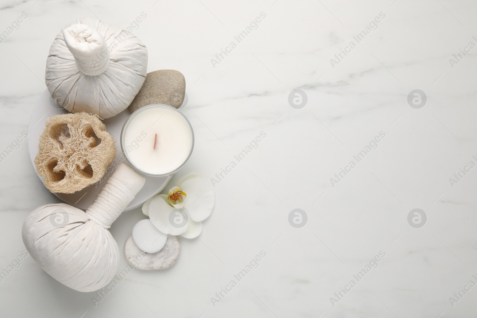 Photo of Flat lay composition with different spa products on white marble table. Space for text