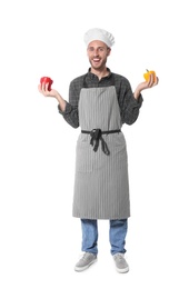 Professional chef holding peppers on white background